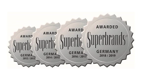 Vier ineinander laufende Kreise mit der Inschrift "Superbrand"